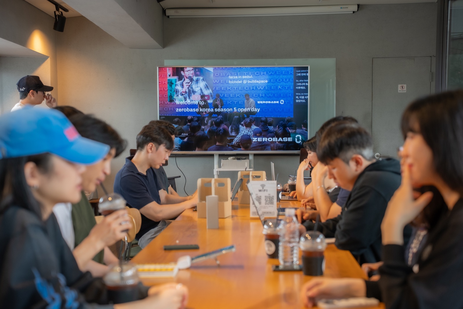 Founders working around a shared table at Zerobase