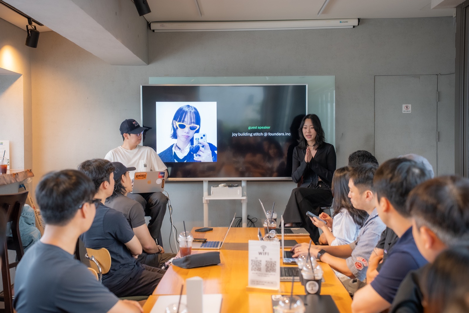 A guest speaker talking with founders around the table