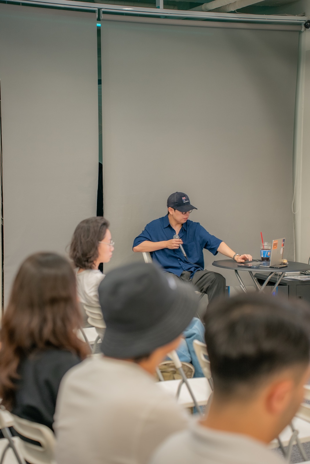 A host leading a conversation with founders
