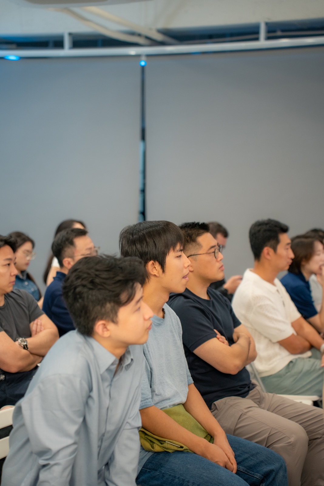 The audience listening closely during a founder session