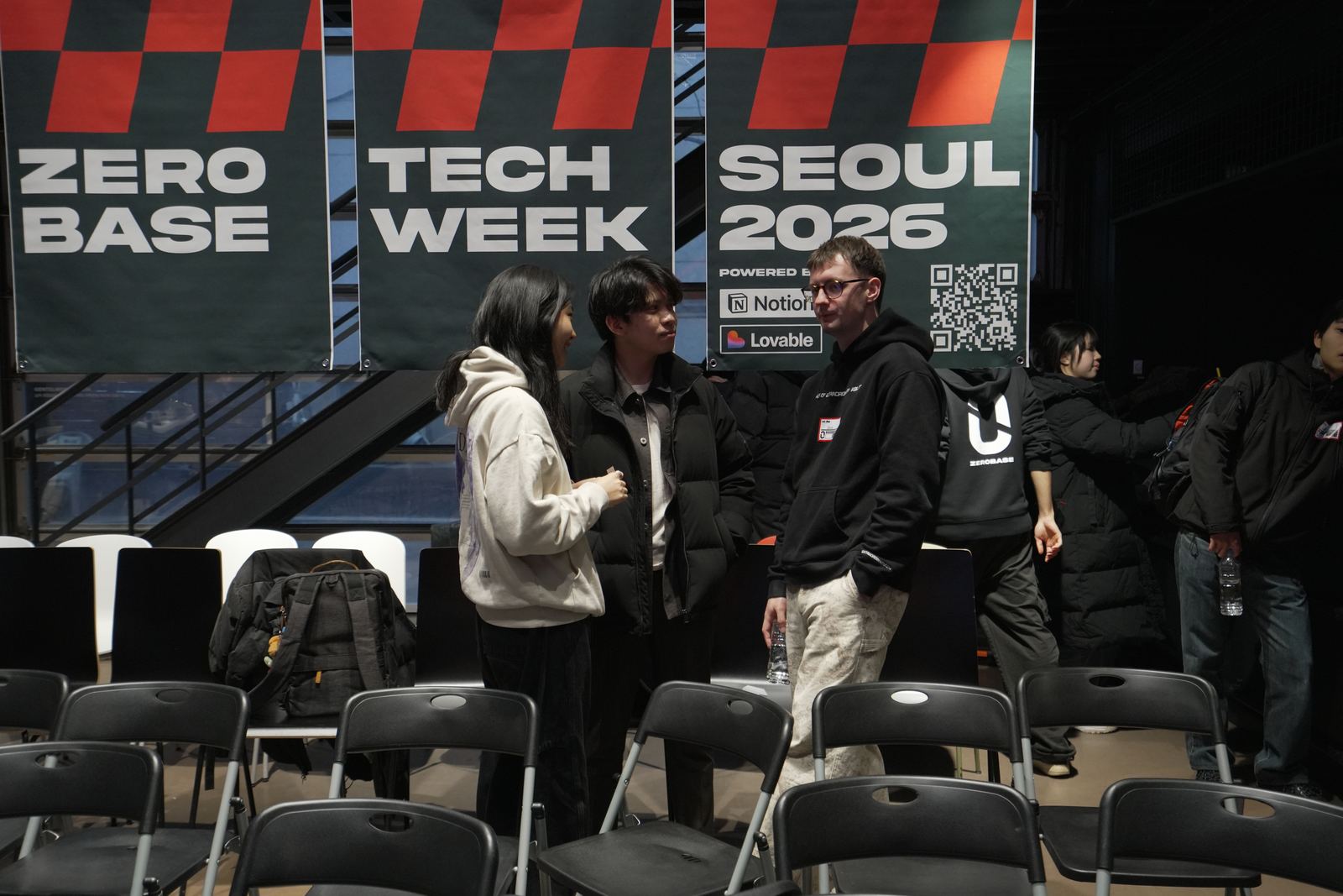 Founders meeting under Zerobase Tech Week banners